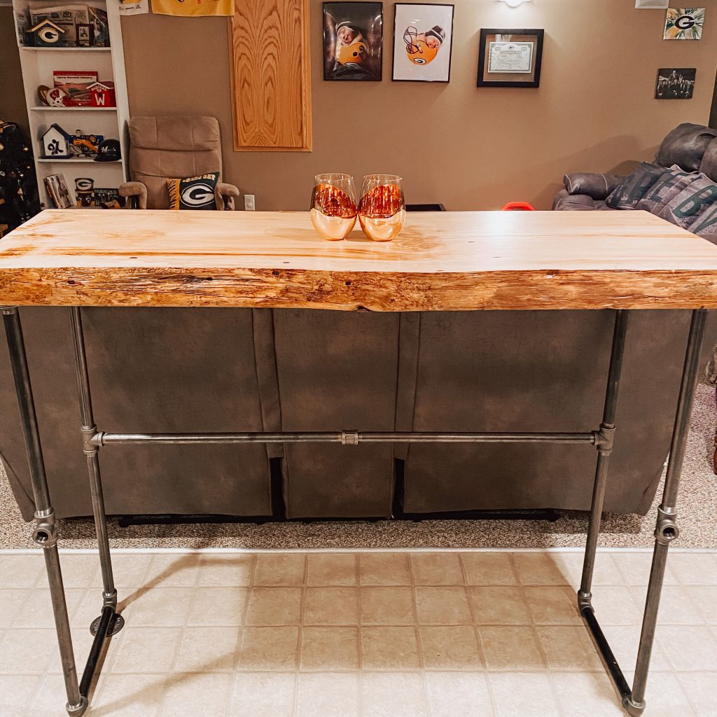 raw edge pub table with black metal legs
